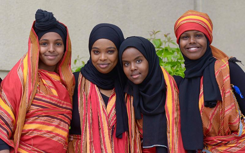 girls in a group shot wearing traditional garb