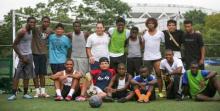 A group of soccer players post for a picture.