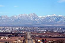 the mountains rise behind the town of Las Cruces, New Mexico.